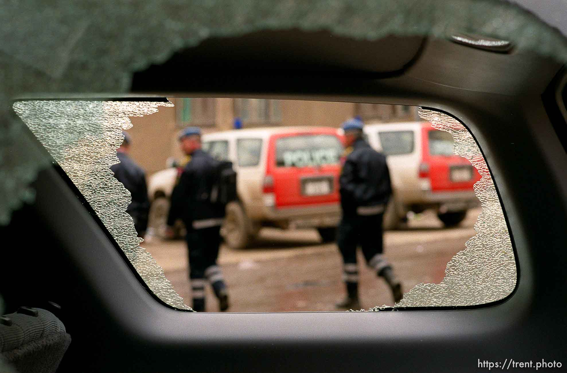 Broken windows in a UNMIK police vehicle.