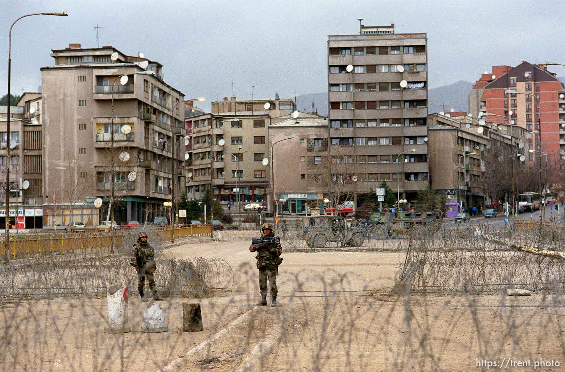 French KFOR troops at the main bridge seperating the Serbs on the north side and the Albanians on the south. This is looking north.