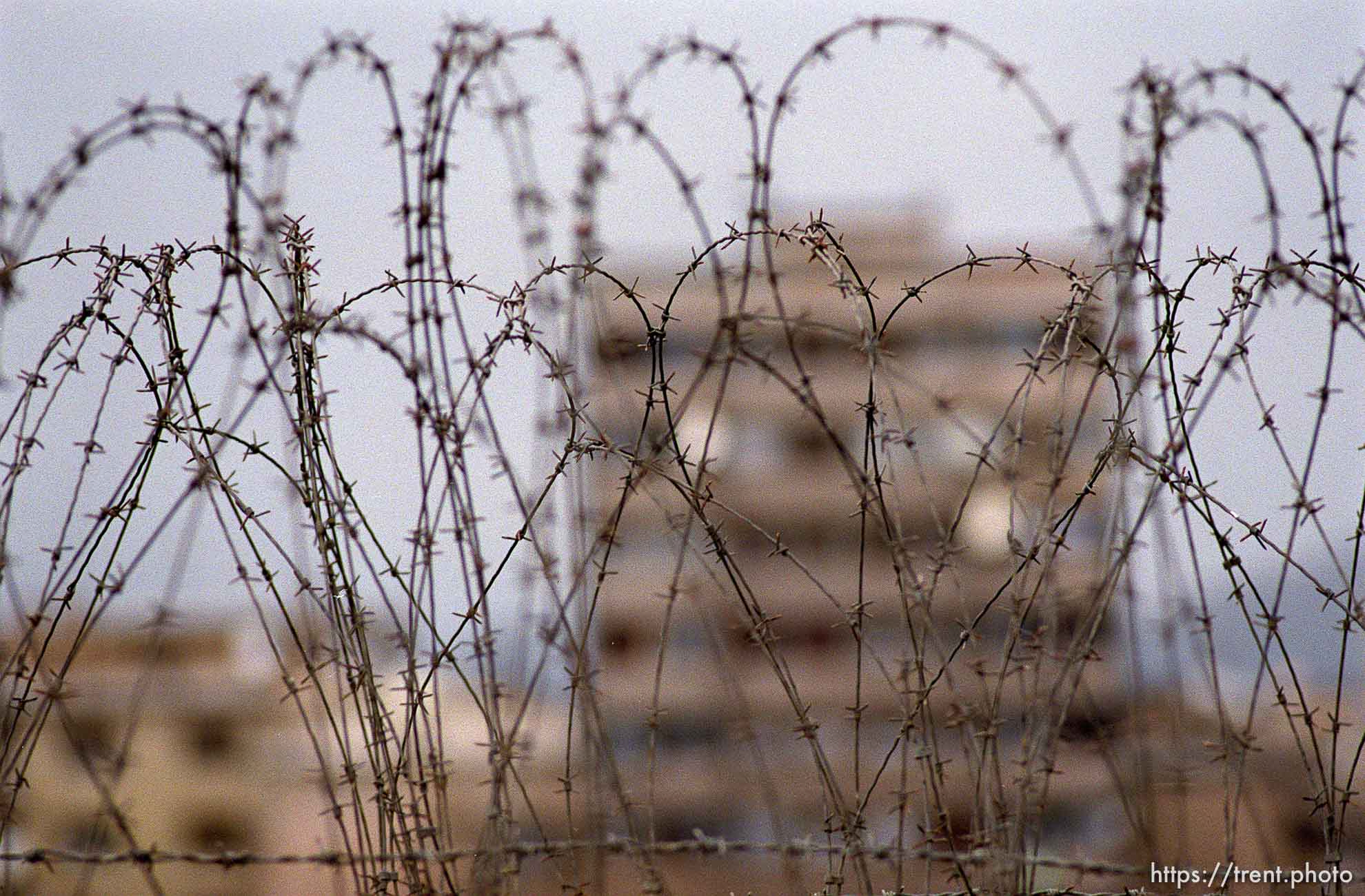 Barbed wire at the main bridge seperating the Serbs on the north side and the Albanians on the south. This is looking north.