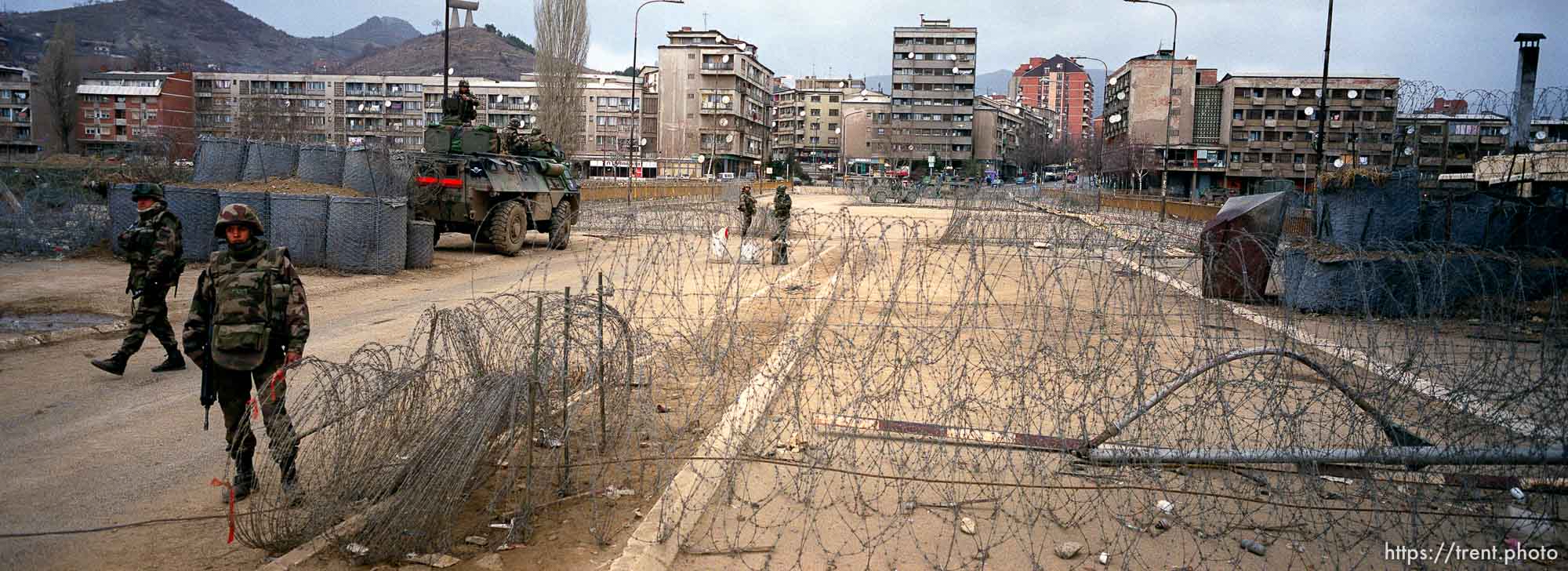 French KFOR troops at the main bridge seperating the Serbs on the north side and the Albanians on the south. This is looking north.