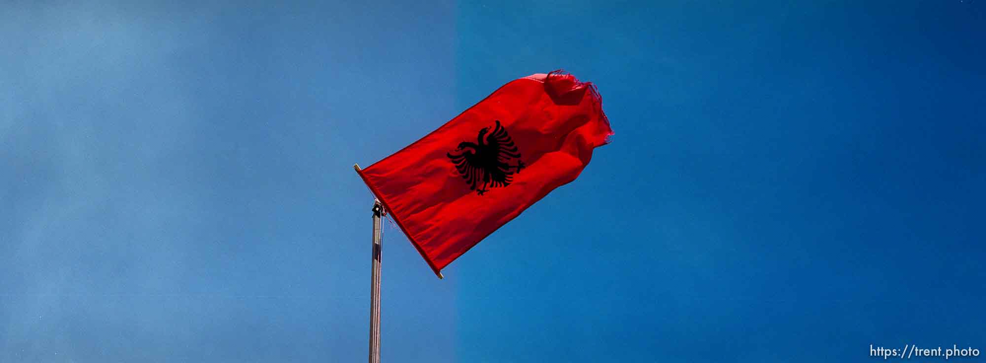 Kosovar Albanian flag over KLA graveyard.