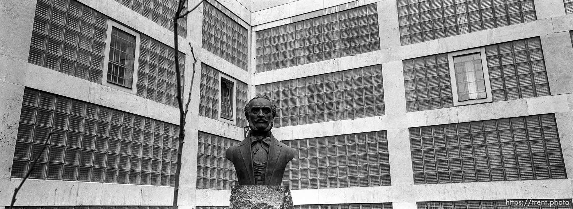 Bust and building.