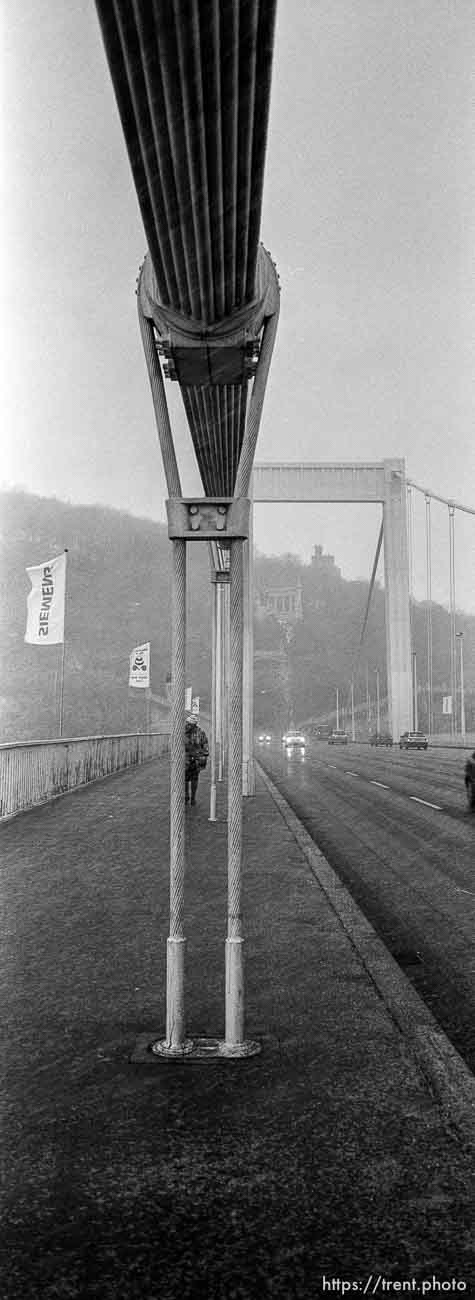 Pedestrian on the Elizabeth Bridge during a snowstorm.