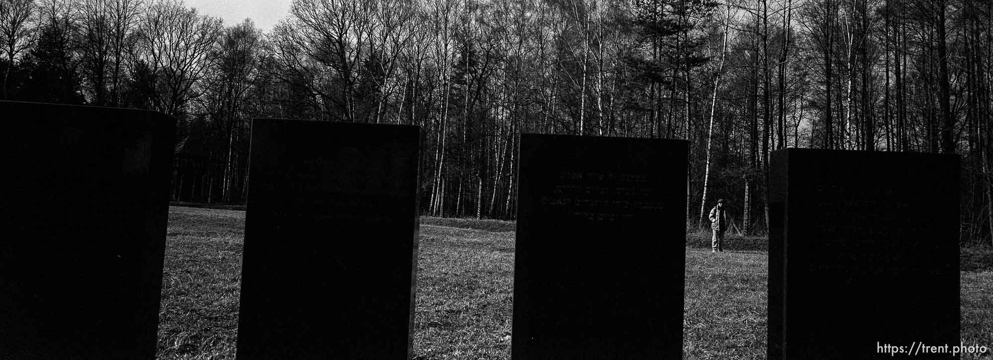 walking in field where bodies were burned at the Birkenau Concentration Camp.