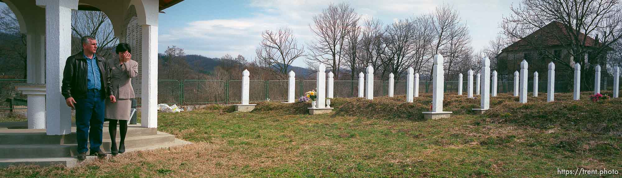 Redzo and Fatima Kurbegovic at the memorial and cemetery for the victims of a massacre by Serbs.