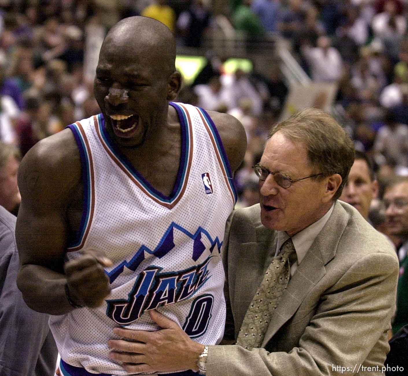 Olden Polynice celebrates victory with Utah General Manager Kevin O'Connor at Jazz vs. Sonics, game 5, 1st round NBA playoffs. Jazz won.