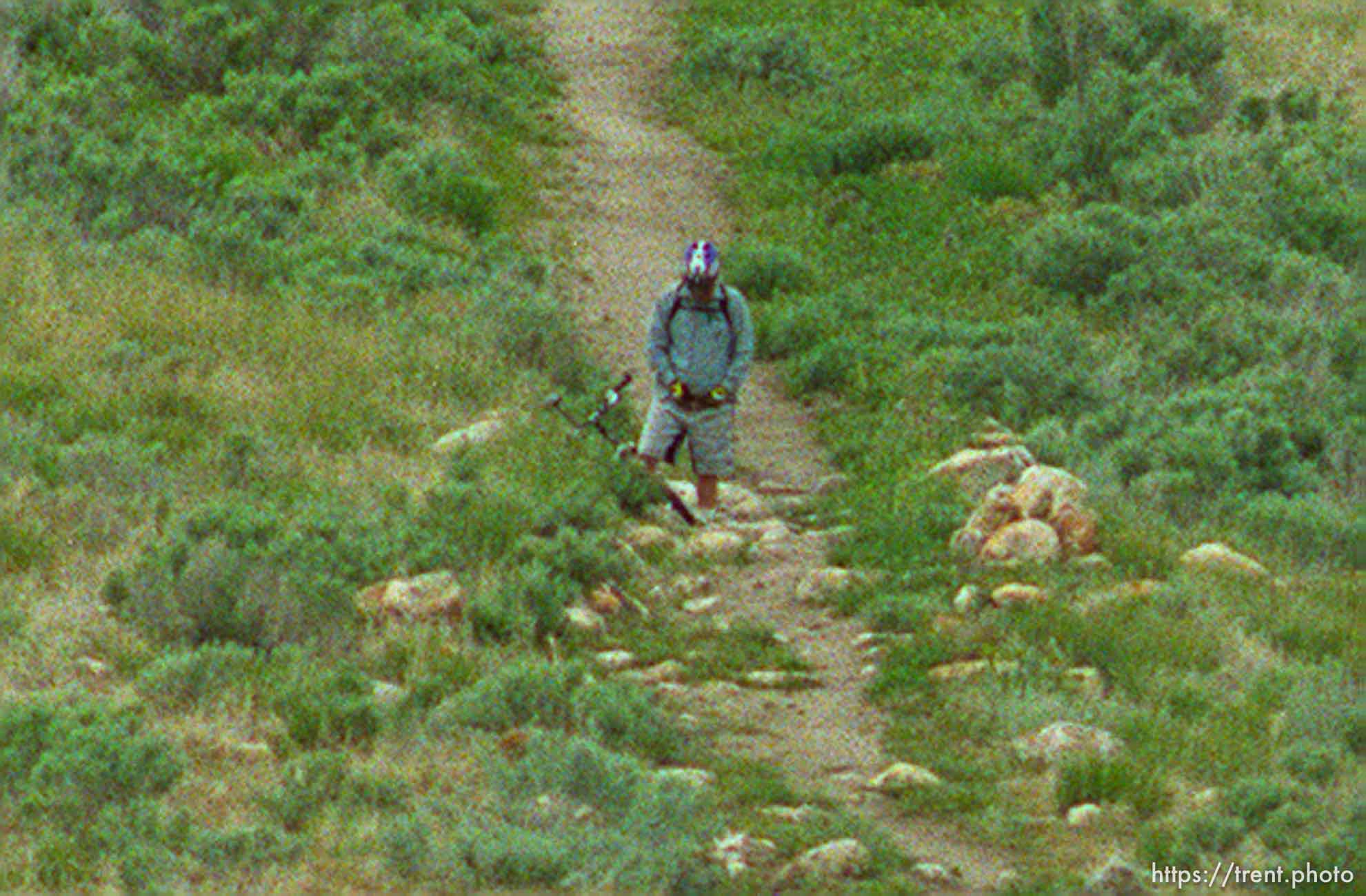 A mountain biker urinates along Antelope Island's Mountain View Trail along the shores of the Great Salt Lake Tuesday afternoon.