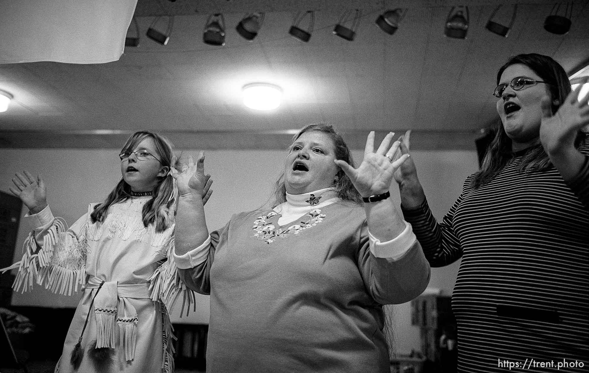 Chastadi Reeve, RaVae Bobo, April Marden singing. Thanksgiving dinner at the Salt Lake City Mission.