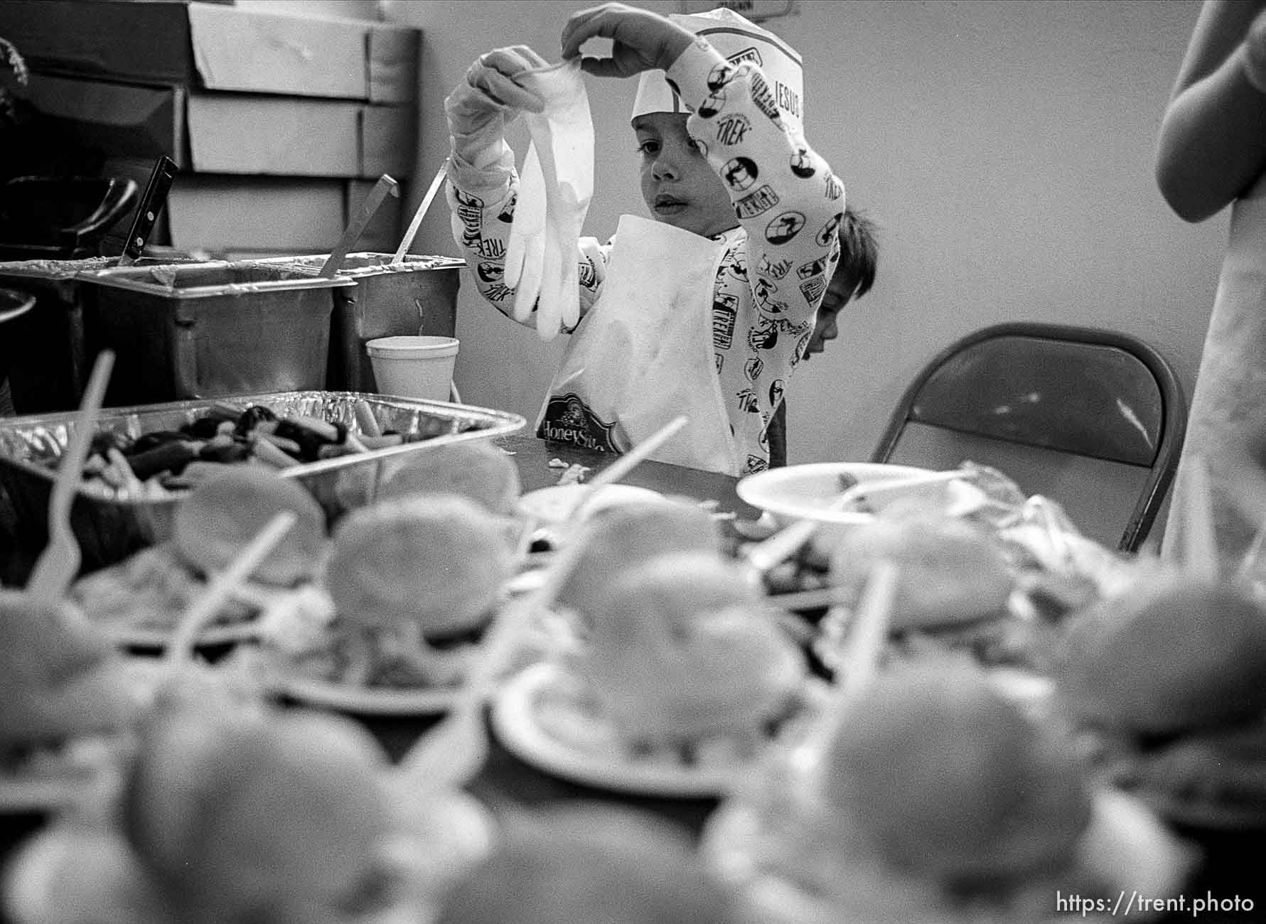 Joshua Arena, 5, at a serving table. Thanksgiving dinner at the Salt Lake City Mission.