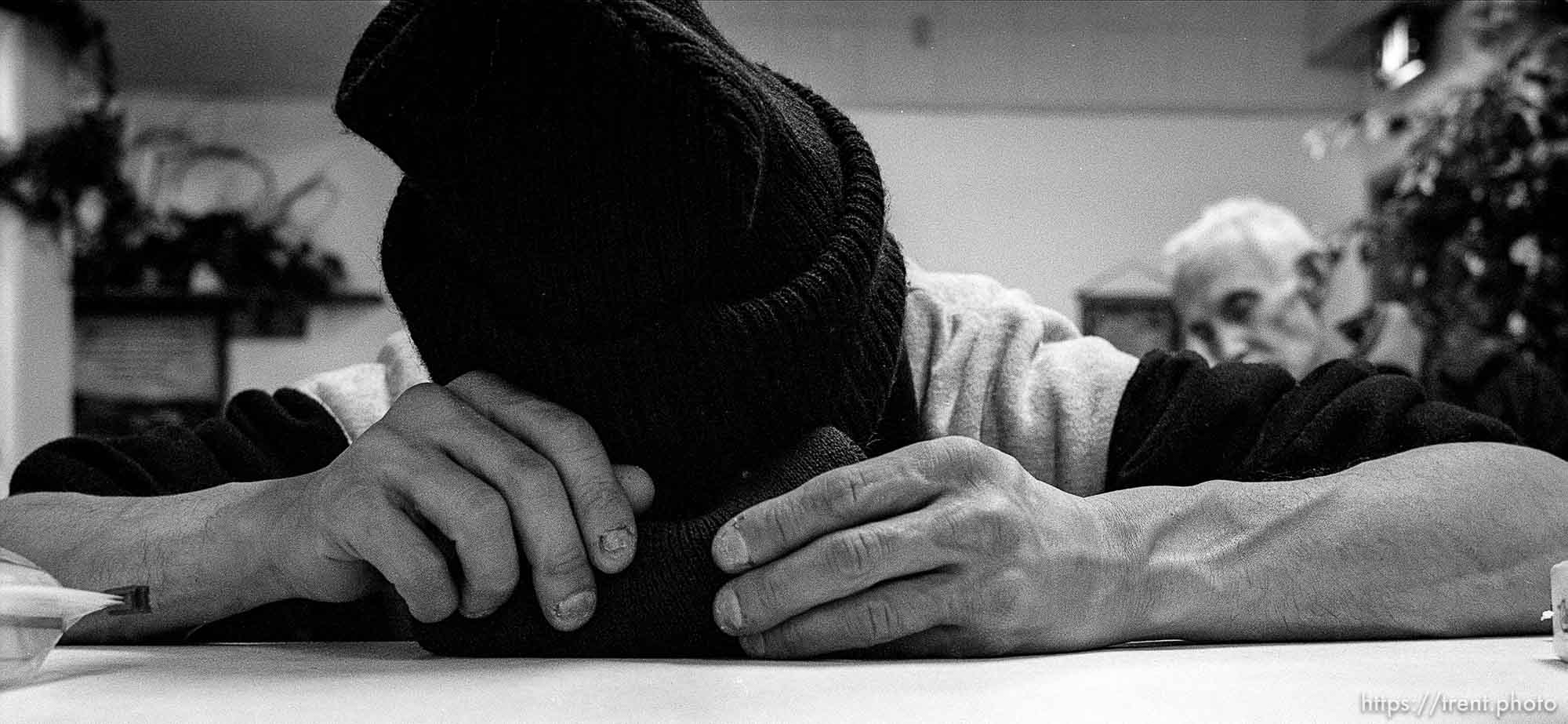 Man asleep Thanksgiving dinner at the Salt Lake City Mission.