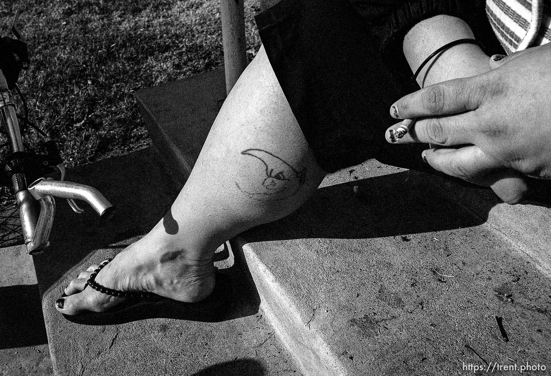 Woman with cigarette and tattoo. Thanksgiving dinner at the Salt Lake City Mission.