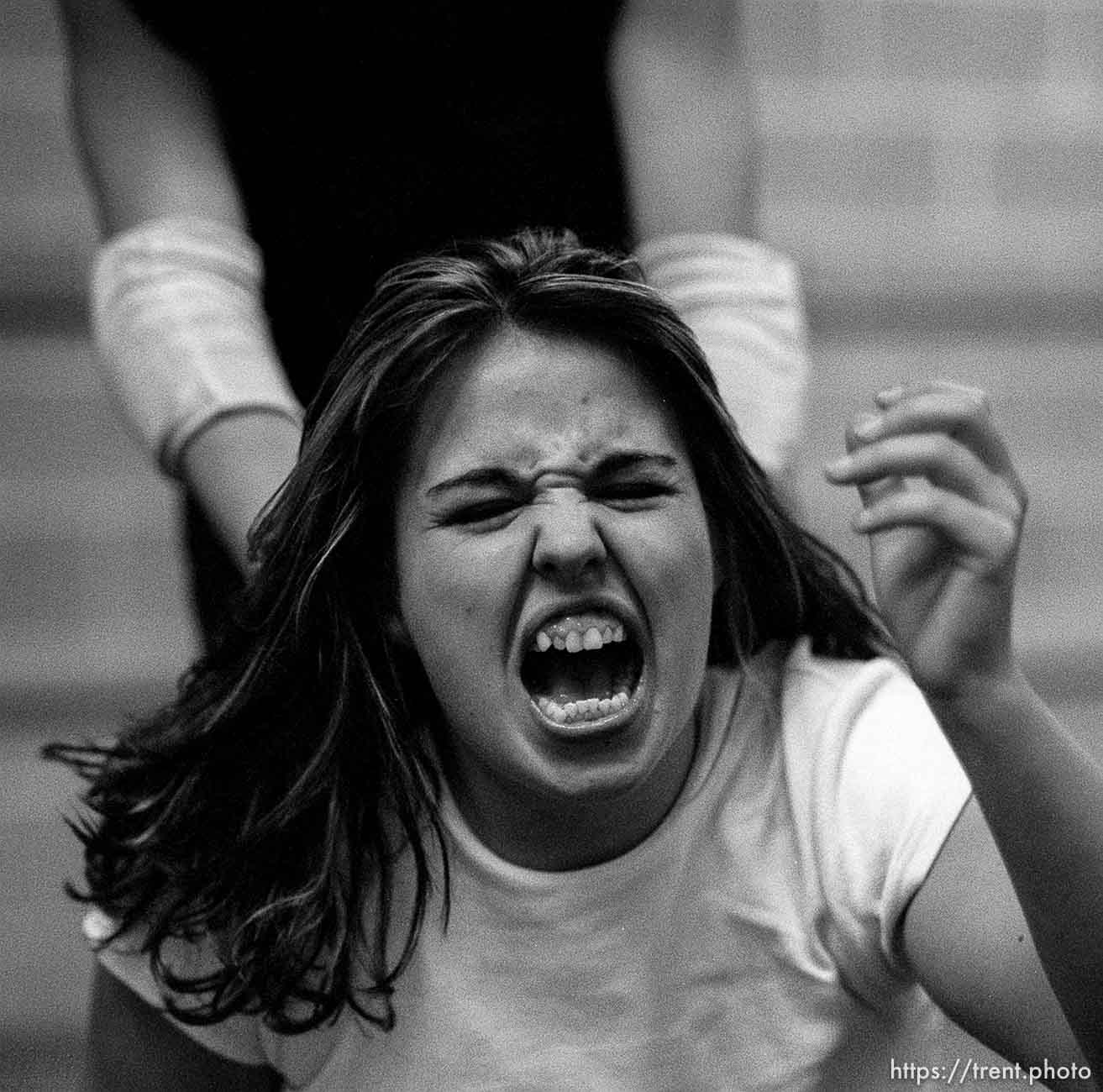 Michelle Morgan reacts to pain in the squared circle during a practice match at the professional wrestling school in Orem, run by wrestler Steve Gatorwolf. photo by Trent Nelson. 11/29/2000