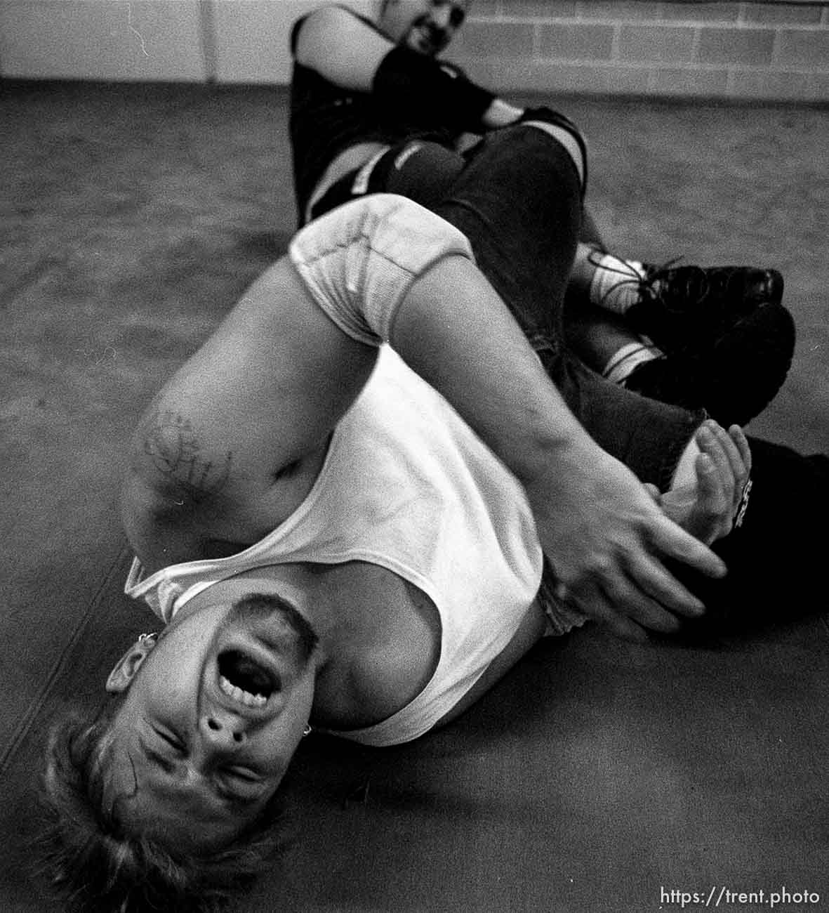 Rick Slusher feels the pain of J.R. Torina's submission hold, during a practice match at the professional wrestling school in Orem, run by wrestler Steve Gatorwolf. photo by Trent Nelson. 11/29/2000