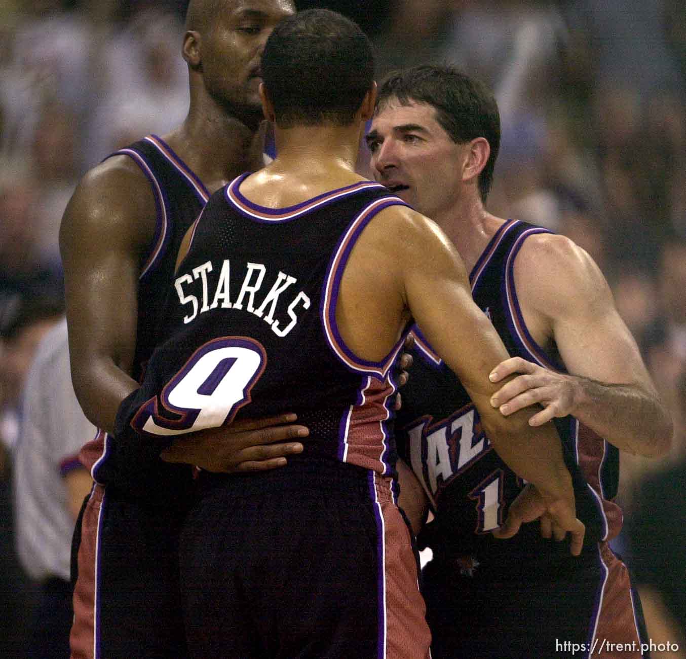 Bryon Russell and John Stockton hold back a piss-off John Starks as the Utah Jazz face the Dallas Mavericks in game four of their first round playoff series, in Dallas Tuesday.  05/01/2001