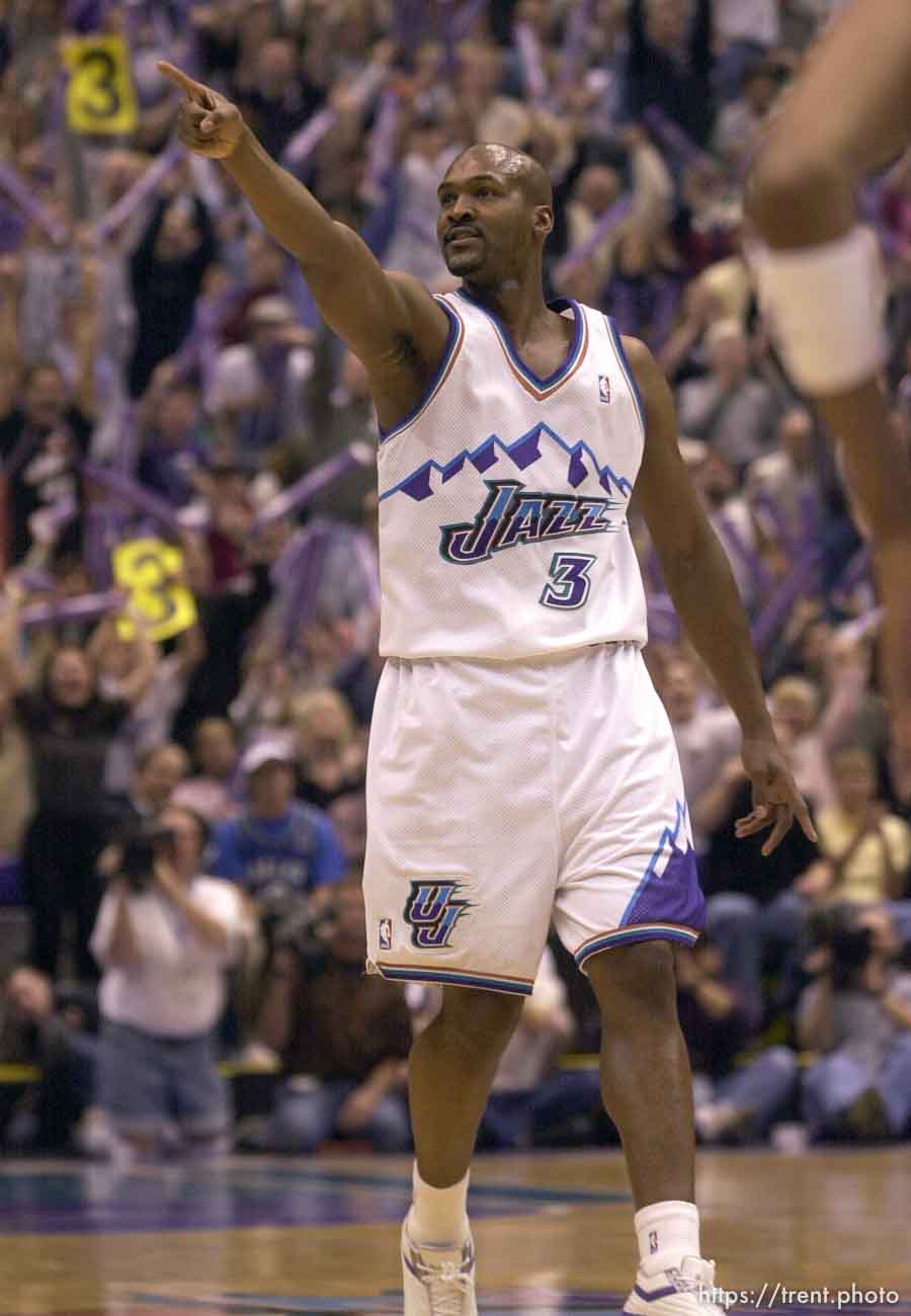 Bryon Russell points into the crowd after sinking a three-pointer as the Utah Jazz face the Dallas Mavericks in game five of their first round playoff series, in Salt Lake City Thursday.  05/03/2001