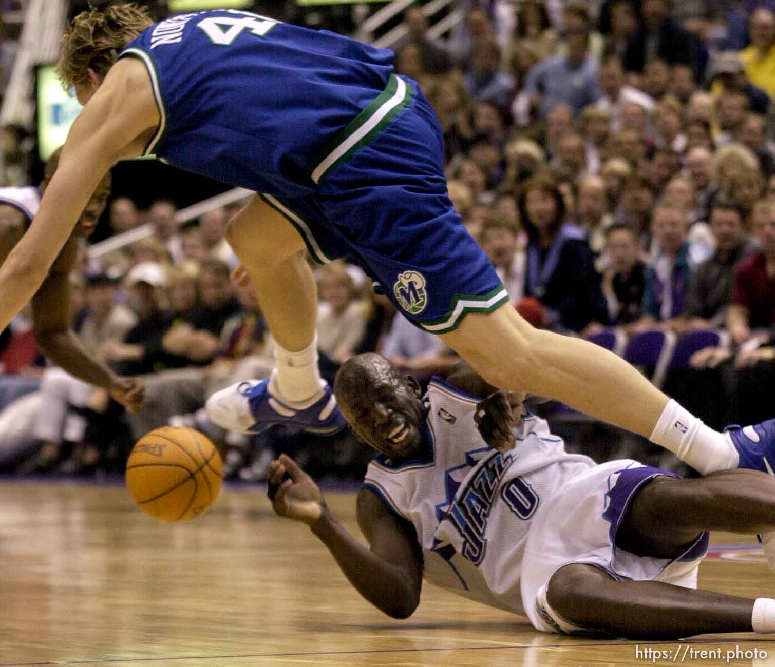 Dirk Nowitzki goes over Olden Polynice as the Utah Jazz face the Dallas Mavericks in game five of their first round playoff series, in Salt Lake City Thursday.