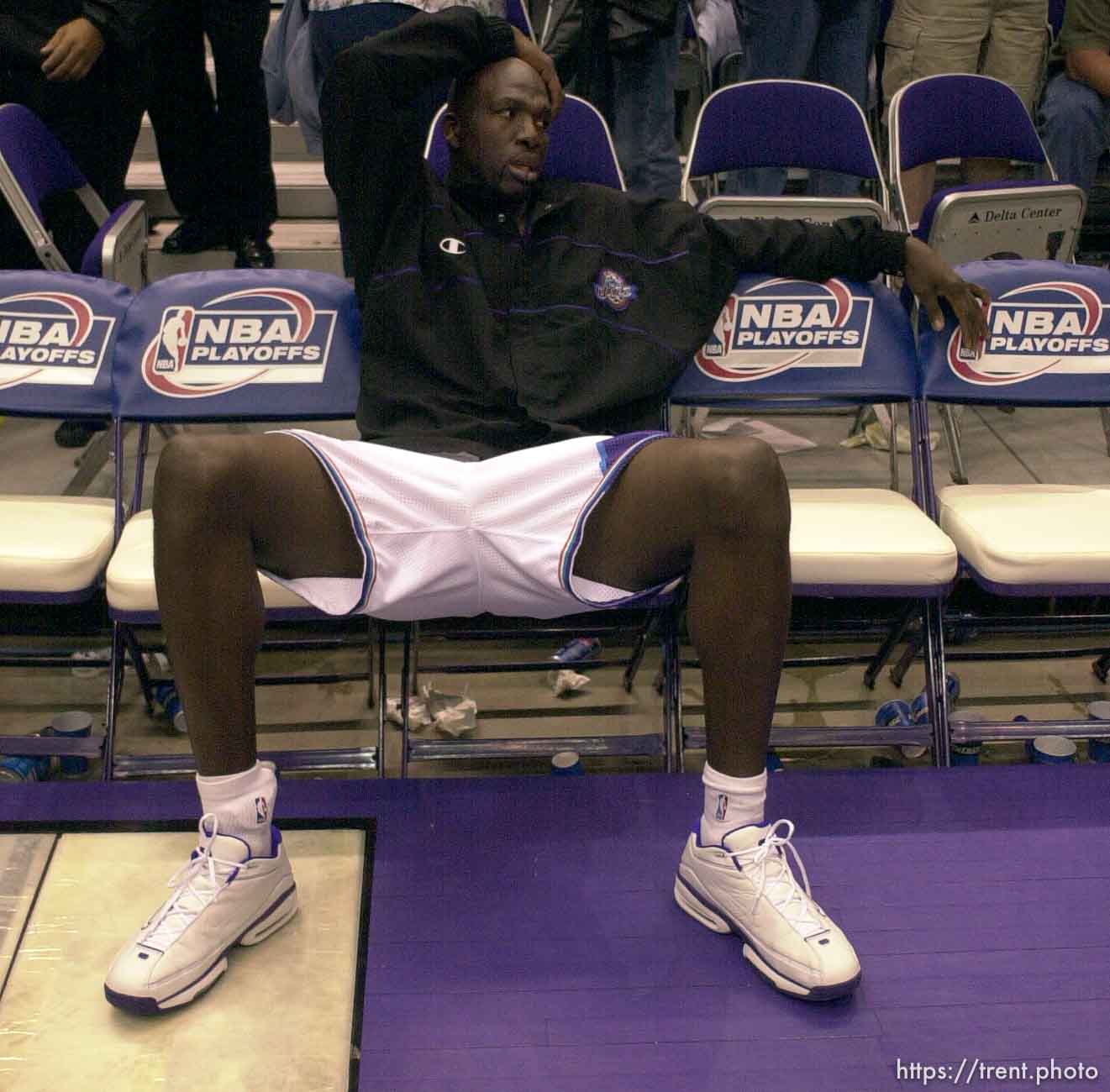 Olden Polynice on the bench alone after losing the series as the Utah Jazz face the Dallas Mavericks in game five of their first round playoff series, in Salt Lake City Thursday.  05/03/2001