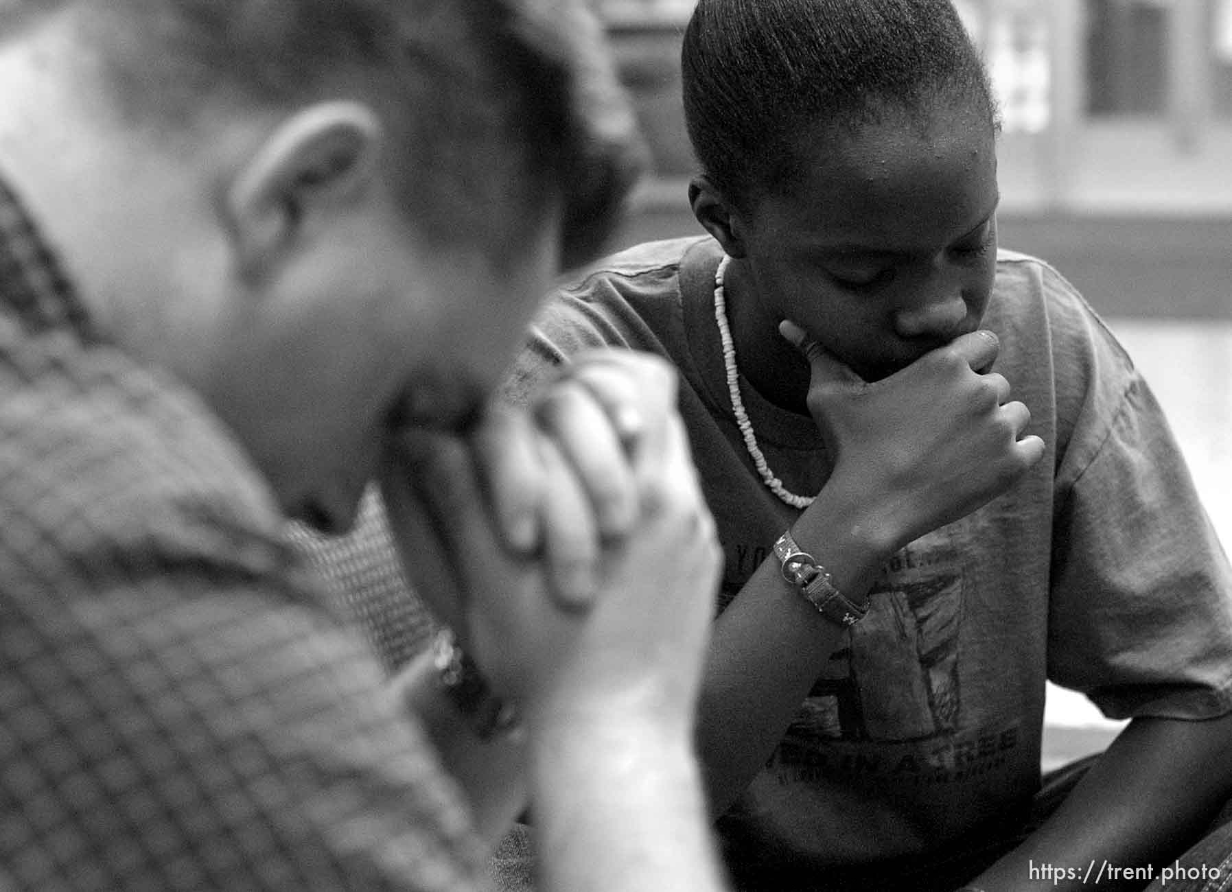 Four University of Utah students gathered to pray to God for the safety of the United States of America Tuesday night, approximately twelve hours following the world's worst terrorist attack. Red Shirt: Ryan Kimble, Blue Shirt/White Necklace: Alexandria Nash.  09/11/2001, 7:23:36 PM