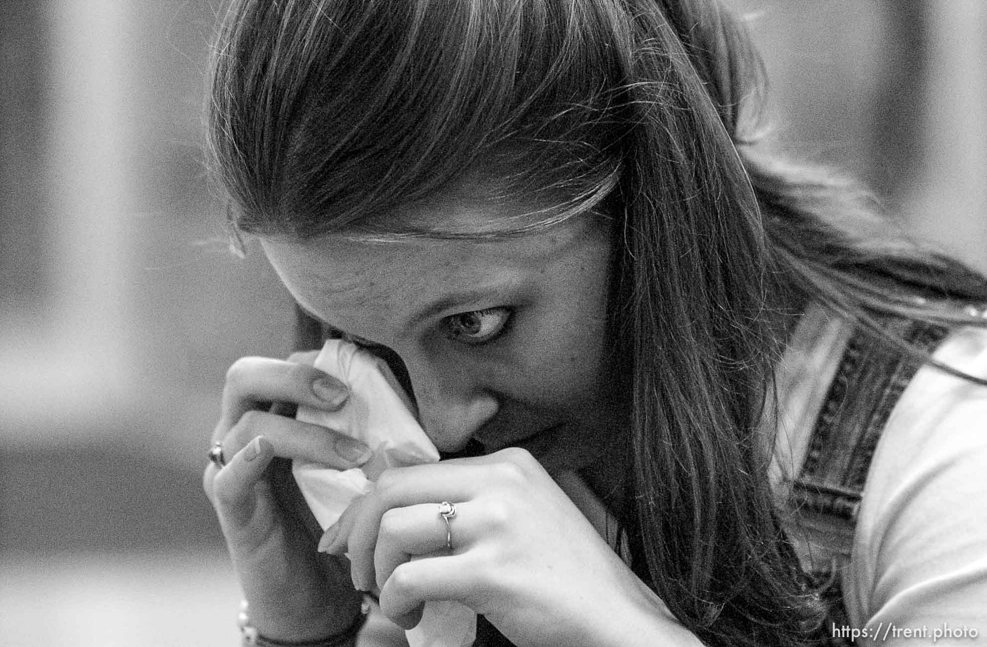 Liz Brooks wipes away a tear. Four University of Utah students gathered to pray to God for the safety of the United States of America Tuesday night, approximately twelve hours following the world's worst terrorist attack.. 09/11/2001, 7:27:00 PM