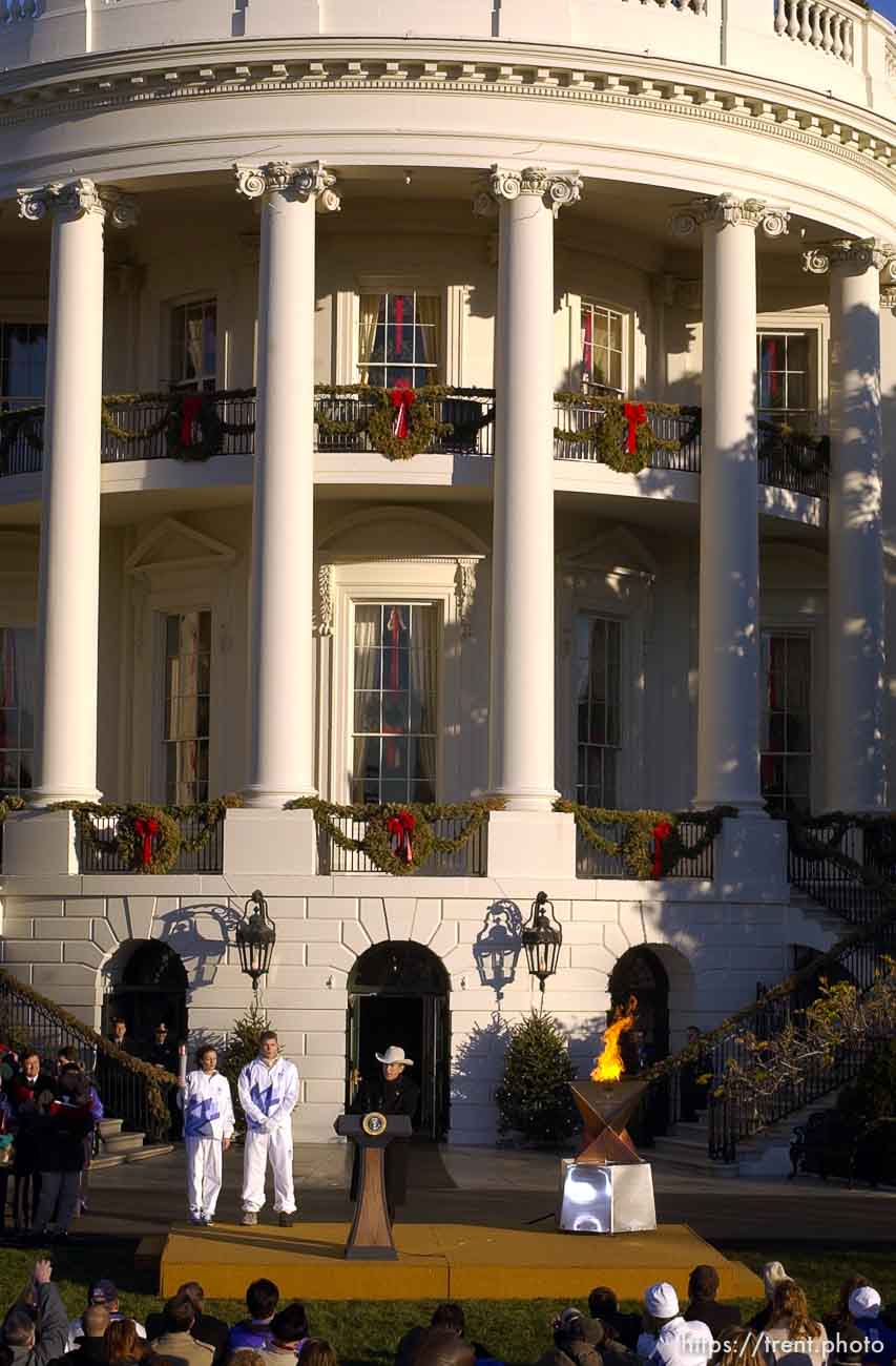 The Olympic Torch comes to the White House. Elizabeth Howell runs it in, President George Bush lights the cauldron, and Eric Jones runs it out.
 12.22.2001, 6:32:15 AM