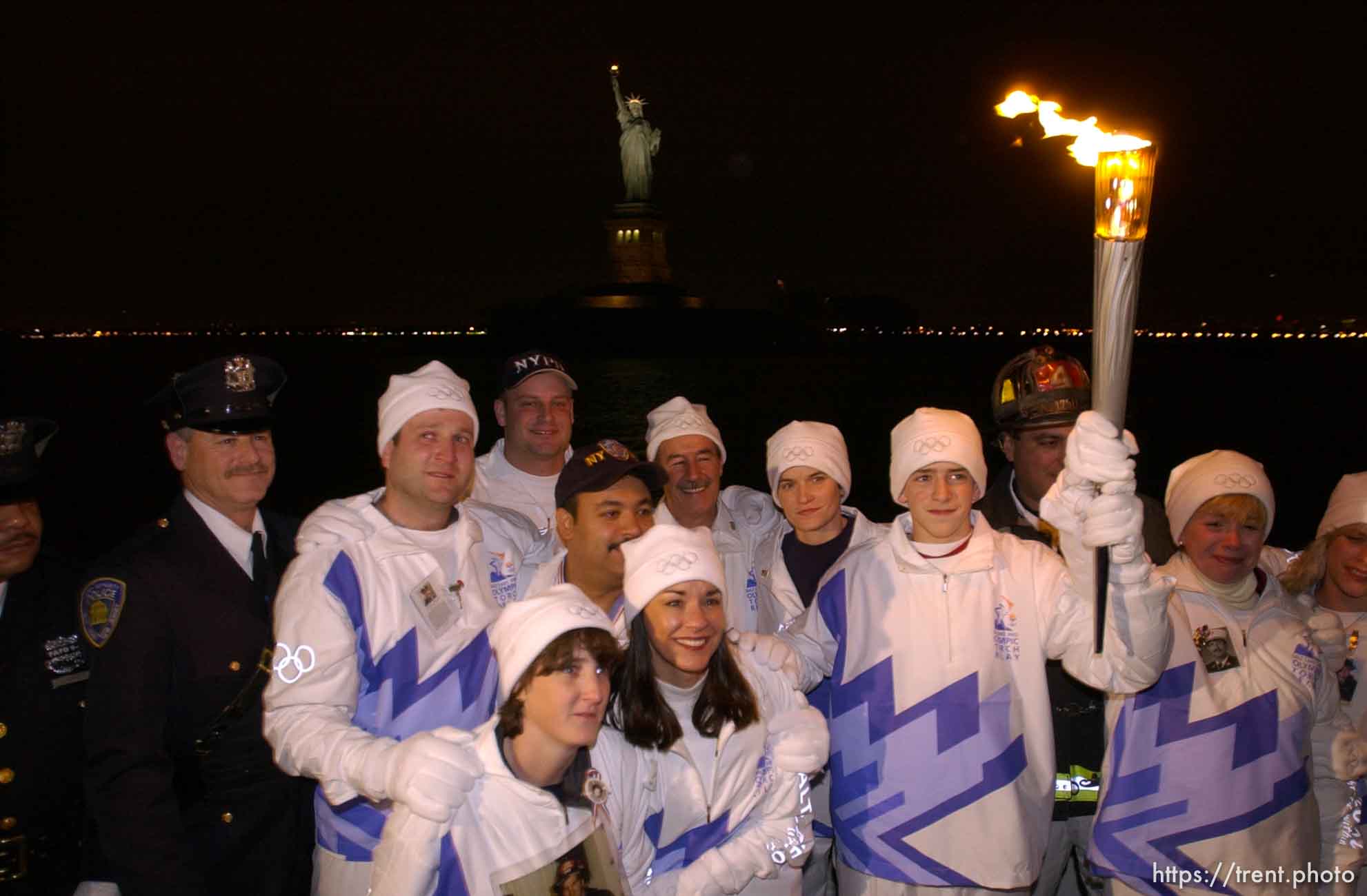 The Olympic Torch commemorates victims and heroes of the World Trade Center attack on a boat near the Statue of Liberty, then proceeds to Rockefeller Plaza where Mayor Giuliani carried the final torch and lit the Olympic cauldron.
 12.23.2001, 5:37:23 PM