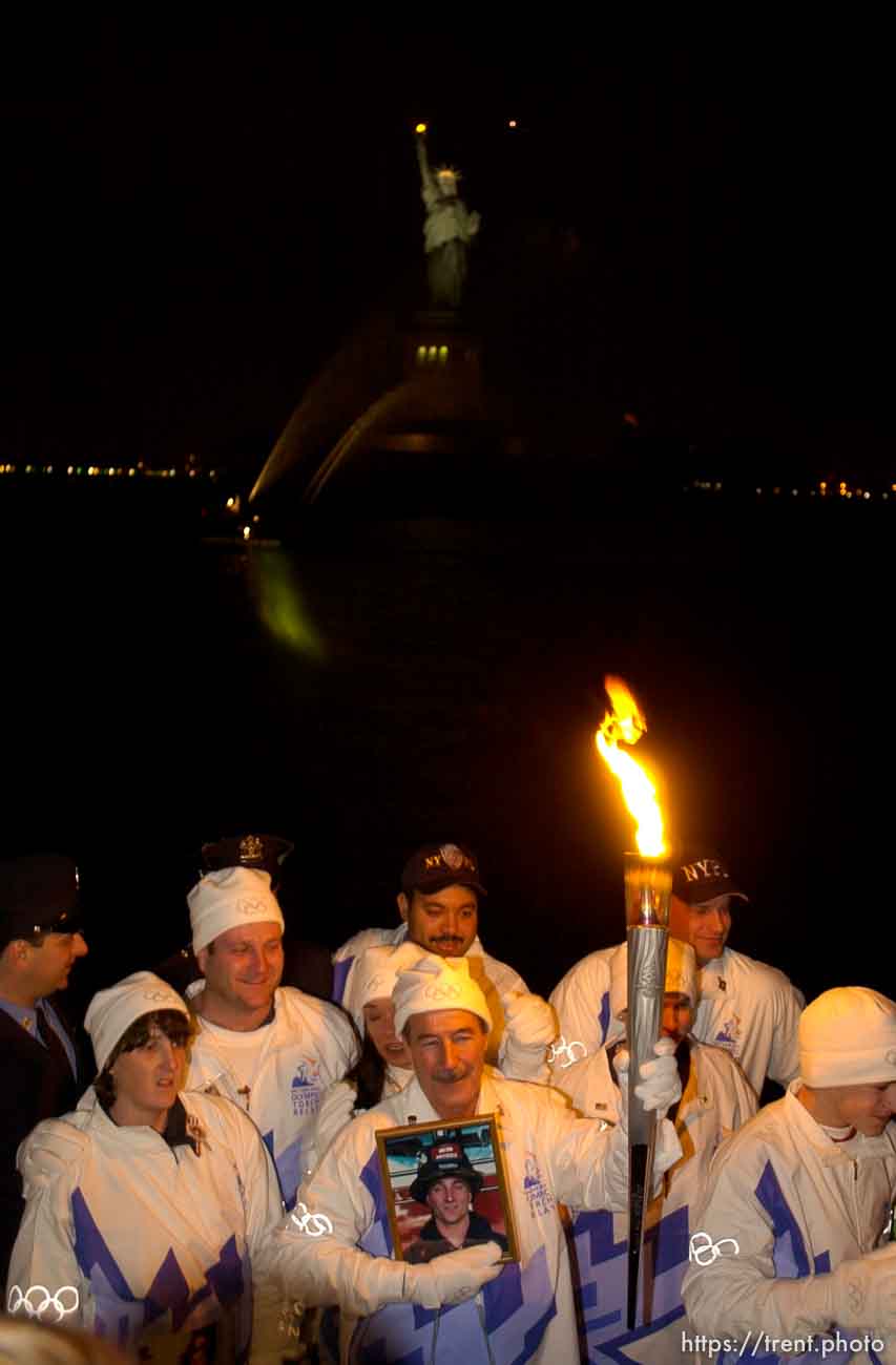 The Olympic Torch commemorates victims and heroes of the World Trade Center attack on a boat near the Statue of Liberty, then proceeds to Rockefeller Plaza where Mayor Giuliani carried the final torch and lit the Olympic cauldron.
 12.23.2001, 5:40:24 PM