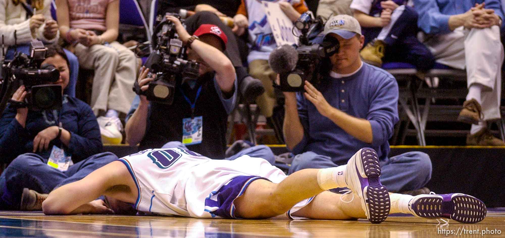 Greg Ostertag, injured on court. Jazz host the Philadelphia 76ers Saturday night at the Delta Center. Jazz win. 12.29.2001, 8:06:52 PM