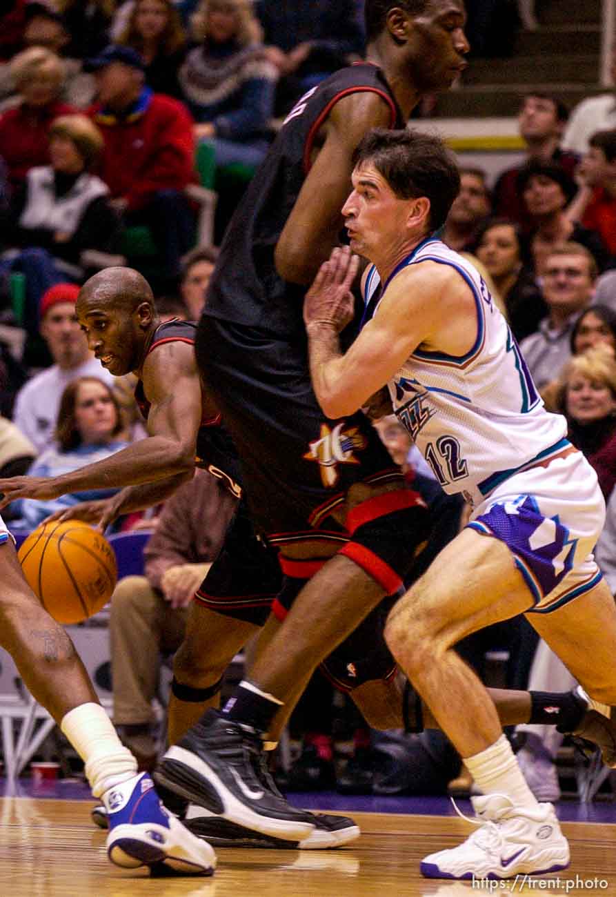 John Stockton fights through a pick. Jazz host the Philadelphia 76ers Saturday night at the Delta Center. Jazz win. 12.29.2001, 9:27:20 PM