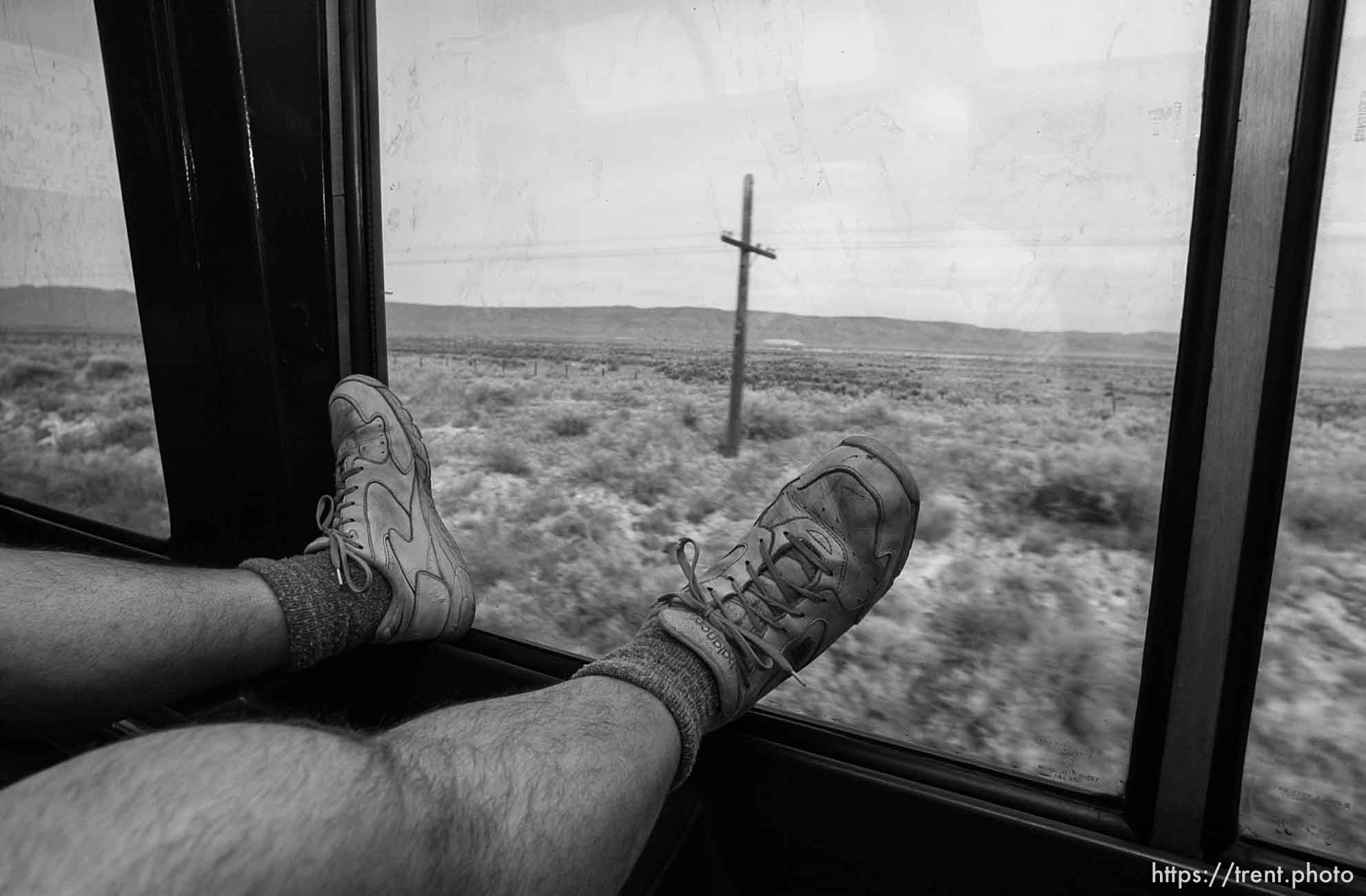 With his legs up on the window in the observation car is Rich, a Sacramento man who frequently rides from California to Boston; 03.28.2002, 9:41:05 AM