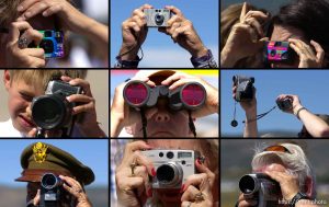 People taking photographs with cameras. Two restored US bombers from the World War Two era (a B-17 Flying Fortress and a B-24 Liberator) landed at the Heber Airport Tuesday afternoon, drawing hundreds of spectators. 07.09.2002, 3:45:09 PM