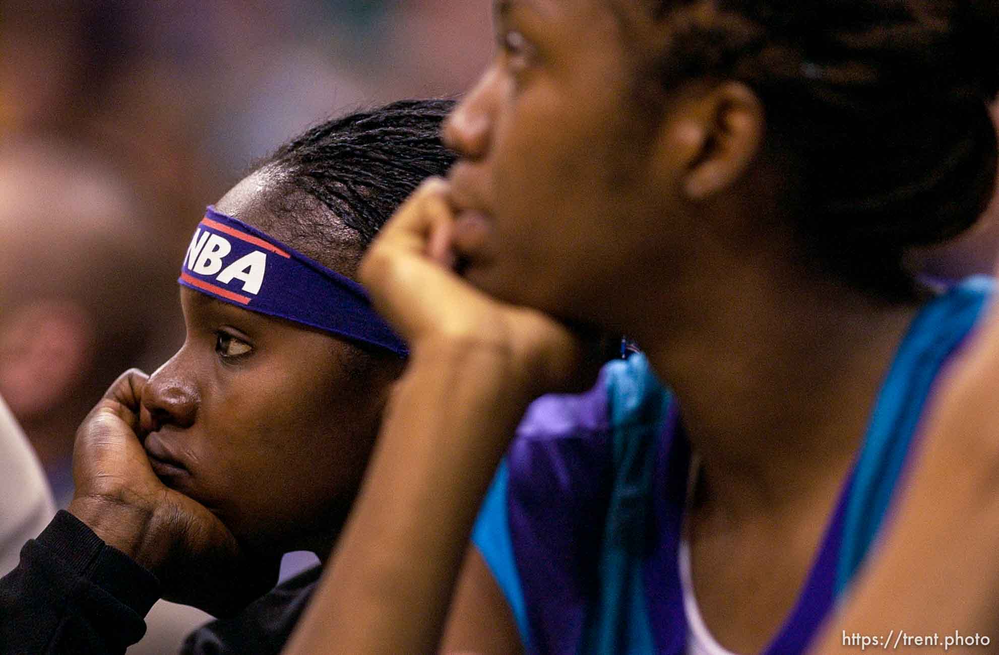 Utah's Marie Ferdinand (left) and Andrea Gardner watch from the bench near the end of Utah's loss to Los Angeles. Los Angeles Sparks vs. Utah Starzz, game two, WNBA playoffs. 08.24.2002, 3:51:46 PM