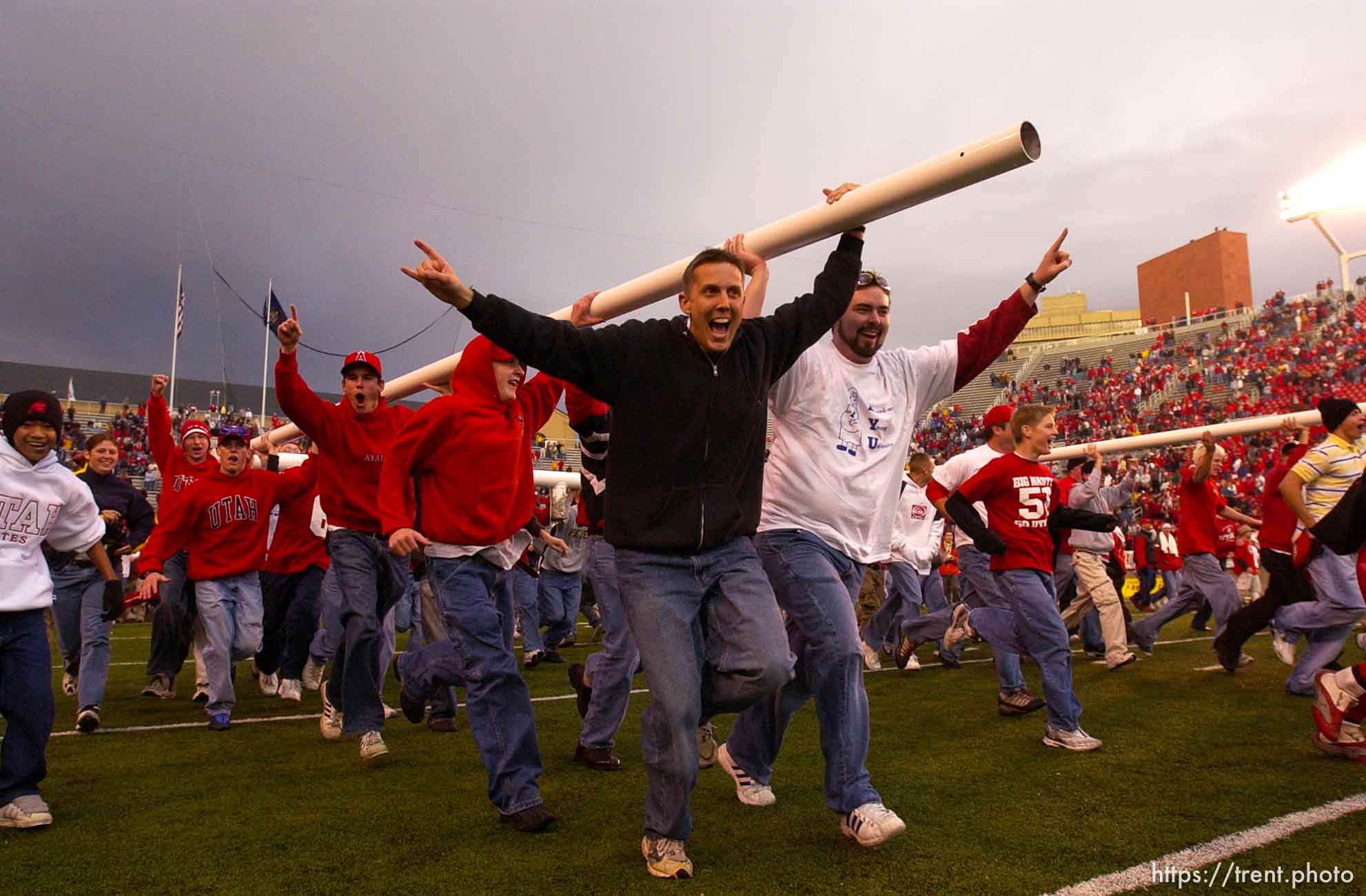 Salt Lake City - Fans bring down the goalposts. Utah vs. BYU football Saturday afternoon at Rice-Eccles Stadium. Utah wins 13-6.  11.23.2002, 4:14:59 PM