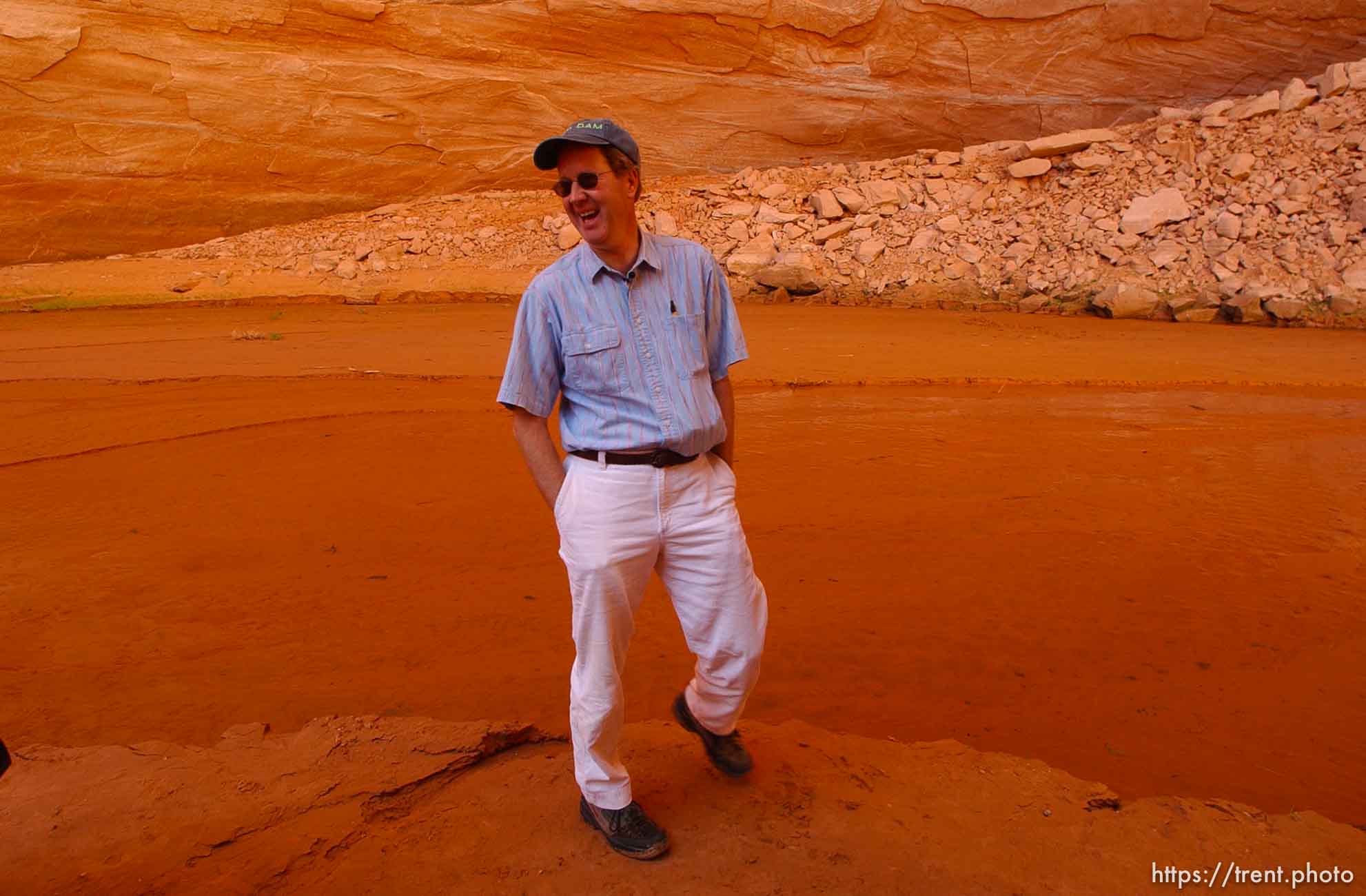 Richard Ingebretsen, founder and president of the Glen Canyon Institute, in Davis Gulch, Lake Powell. Landmarks which had previously been submerged in Glen Canyon are now becoming visible with the lower water levels in Lake Powell.
Photo by Trent Nelson; 05.10.2003, 4:50:47 PM