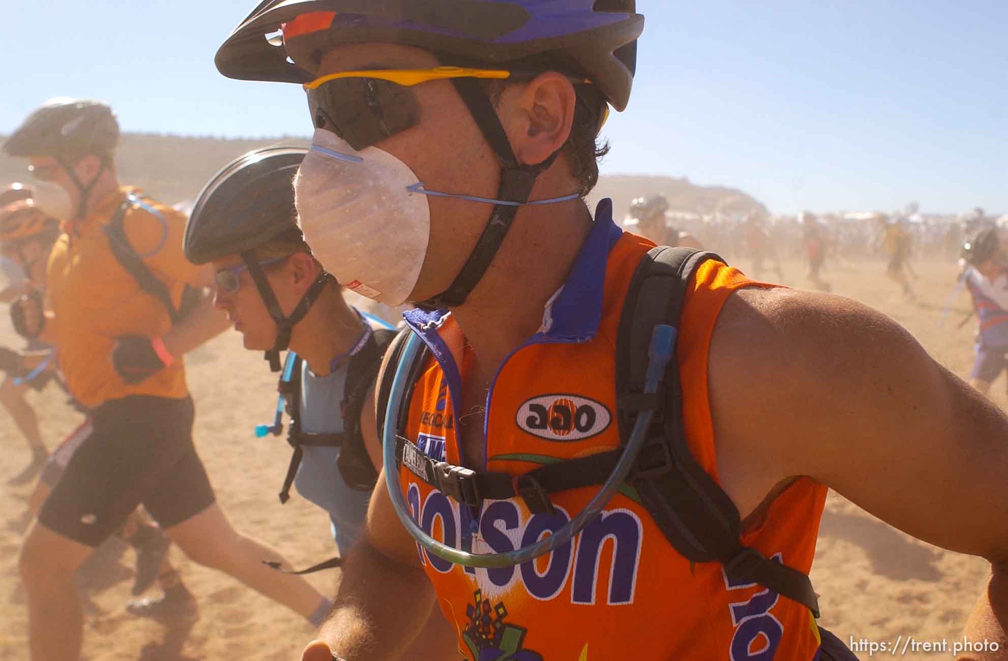 It's a dusty Le Mans style start to the 24 Hours of Moab where racers run up and around a bush before getting on their bikes.