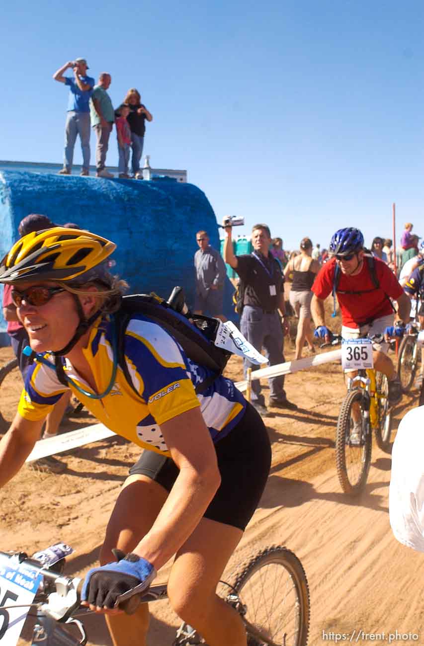 It's a dusty Le Mans style start to the 24 Hours of Moab where racers run up and around a bush before getting on their bikes.