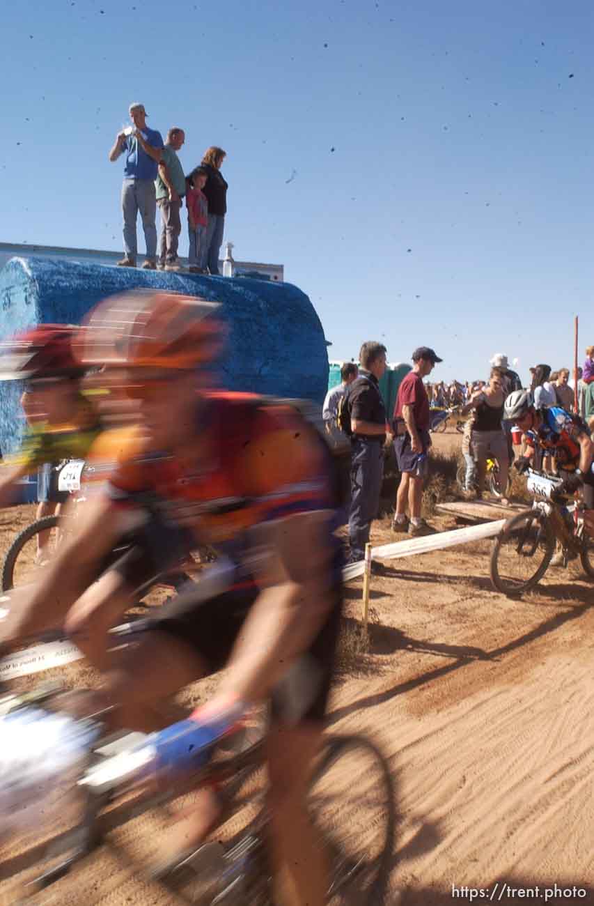 It's a dusty Le Mans style start to the 24 Hours of Moab where racers run up and around a bush before getting on their bikes.