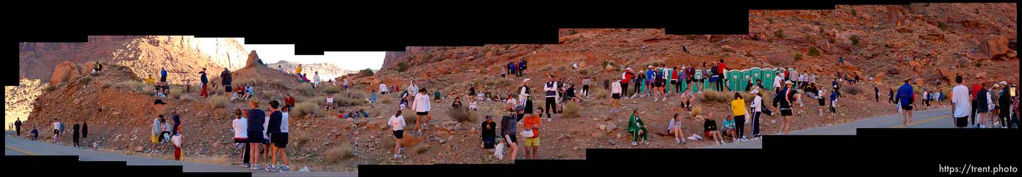 Runners waiting on red rock for the start of the Canyonlands Half Marathon in Moab