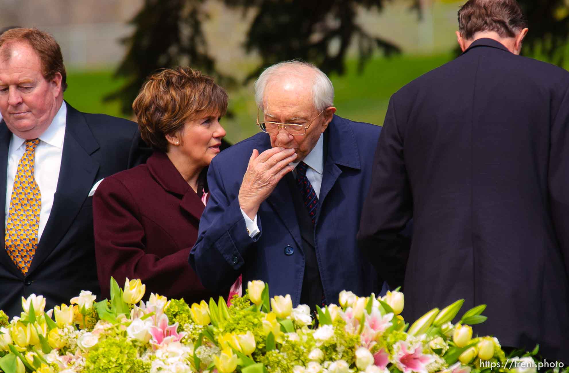 Gordon B. Hinckley kisses his hand and puts it on his wife's coffin, saying his final goodbye. The graveside service for Marjorie Hinckley, wife of LDS President Gordon B. Hinckley, at salt lake city cemetery.