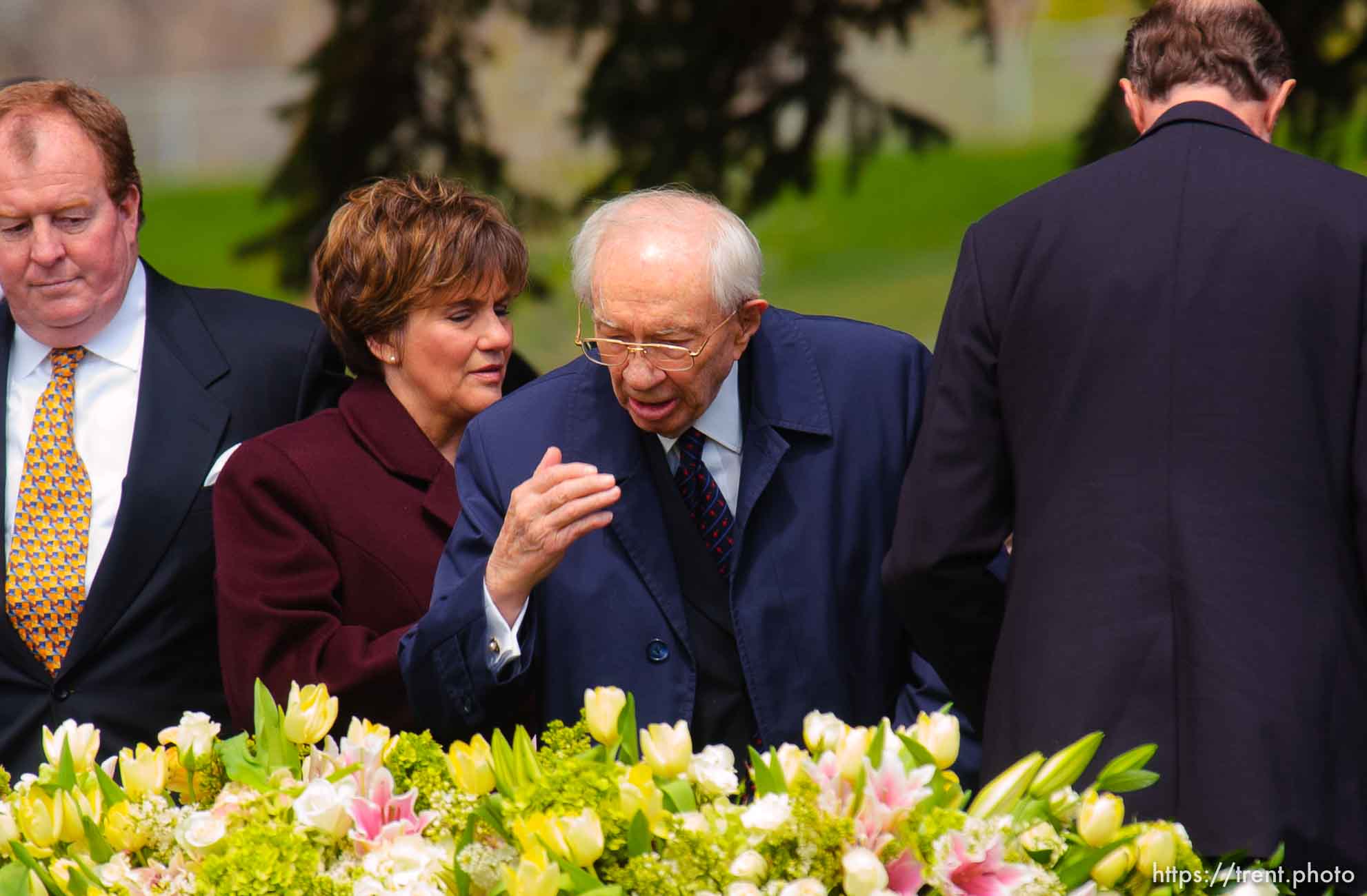 Gordon B. Hinckley kisses his hand and puts it on his wife's coffin, saying his final goodbye. The graveside service for Marjorie Hinckley, wife of LDS President Gordon B. Hinckley, at salt lake city cemetery.