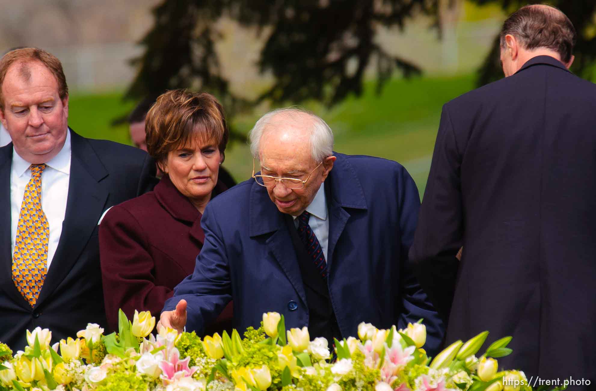 Gordon B. Hinckley kisses his hand and puts it on his wife's coffin, saying his final goodbye. The graveside service for Marjorie Hinckley, wife of LDS President Gordon B. Hinckley, at salt lake city cemetery.