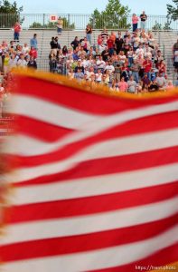 US american flag enters and leaves the arena. West Jordan's Western Stampede rodeo. After 50 years in West Jordan, voters rejected a proposition for a new rodeo grounds, putting the future of the event in question