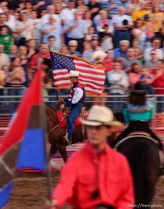 US american flag enters and leaves the arena. West Jordan's Western Stampede rodeo. After 50 years in West Jordan, voters rejected a proposition for a new rodeo grounds, putting the future of the event in question