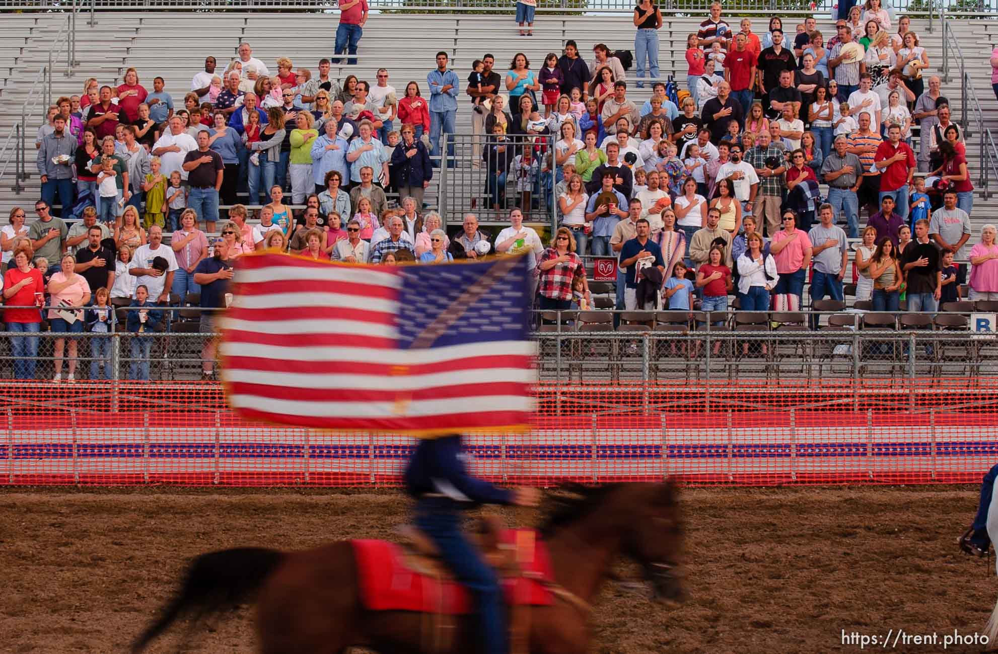 US american flag enters and leaves the arena. West Jordan's Western Stampede rodeo. After 50 years in West Jordan, voters rejected a proposition for a new rodeo grounds, putting the future of the event in question