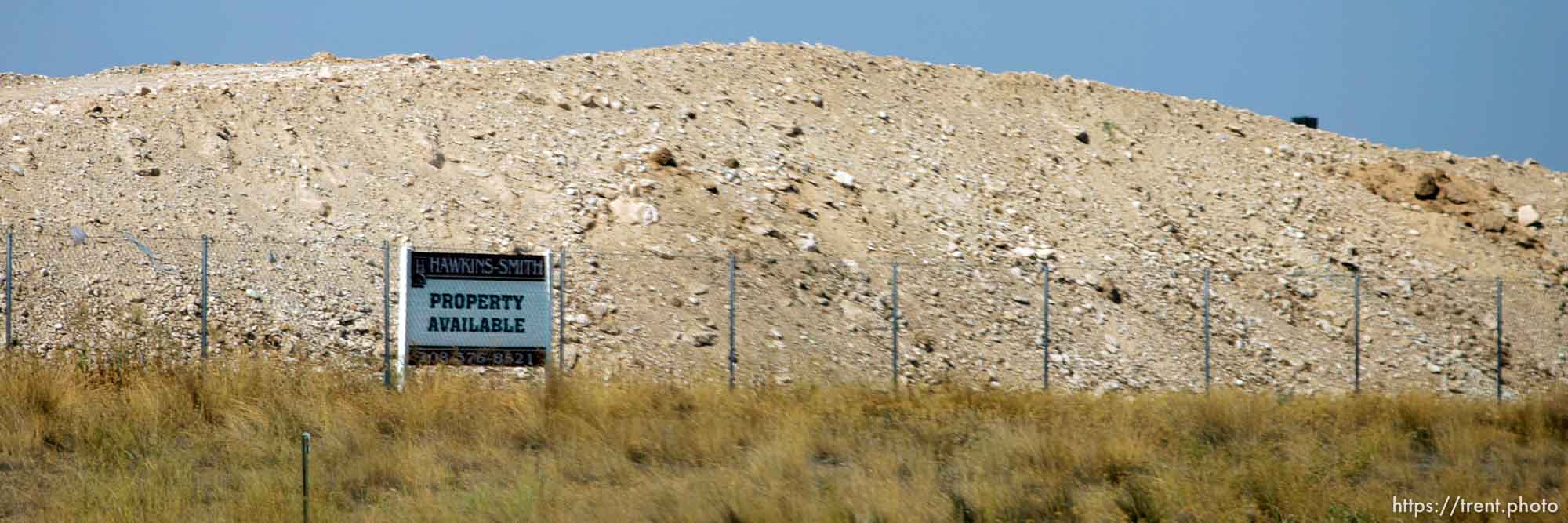 property available and dirt hill. Photos out the window as we drive from Boise to Parma, Idaho. 8.18.2004