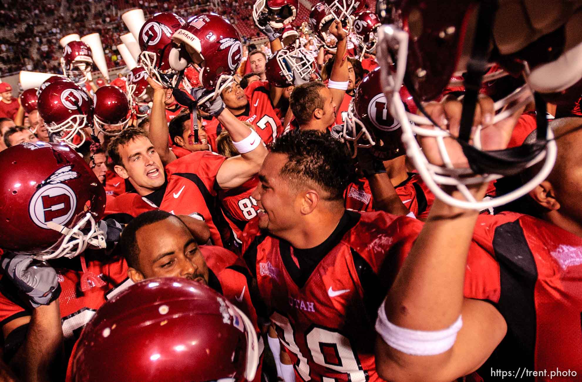 players celebrate victory. Utah vs. Texas A&M college football Thursday evening at Rice-Eccles Stadium.
9.02.2004