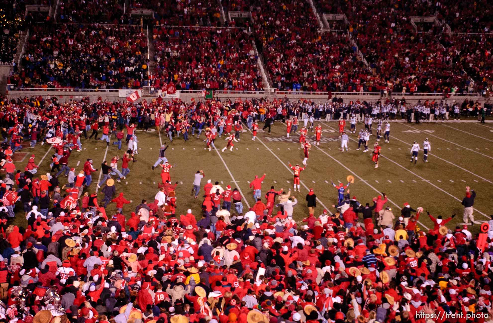 fans swarm the field. Utah vs. BYU college football.
11.20.2004