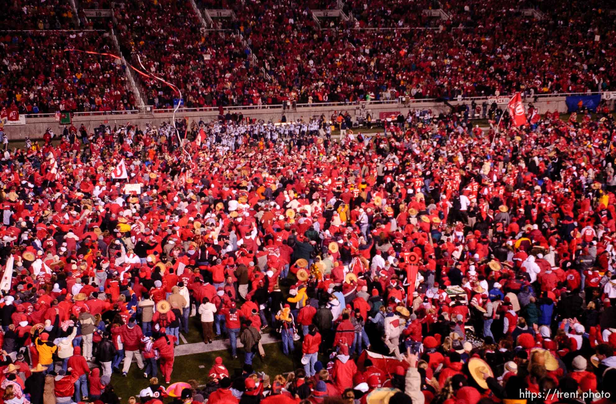 fans swarm the field. Utah vs. BYU college football.
11.20.2004