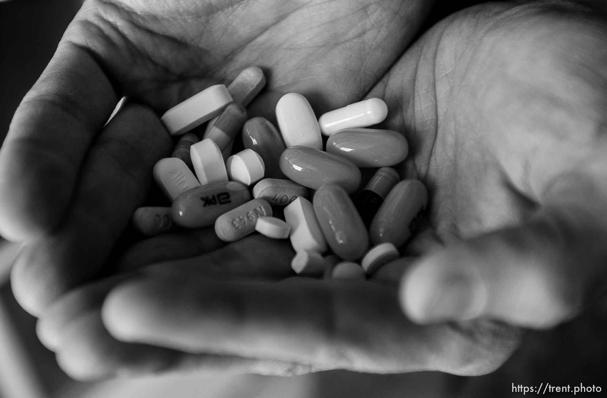 Wendel has been living with the HIV virus for seventeen years. He is pictured in his Salt Lake City apartment, with the pills he takes every day to stay alive.