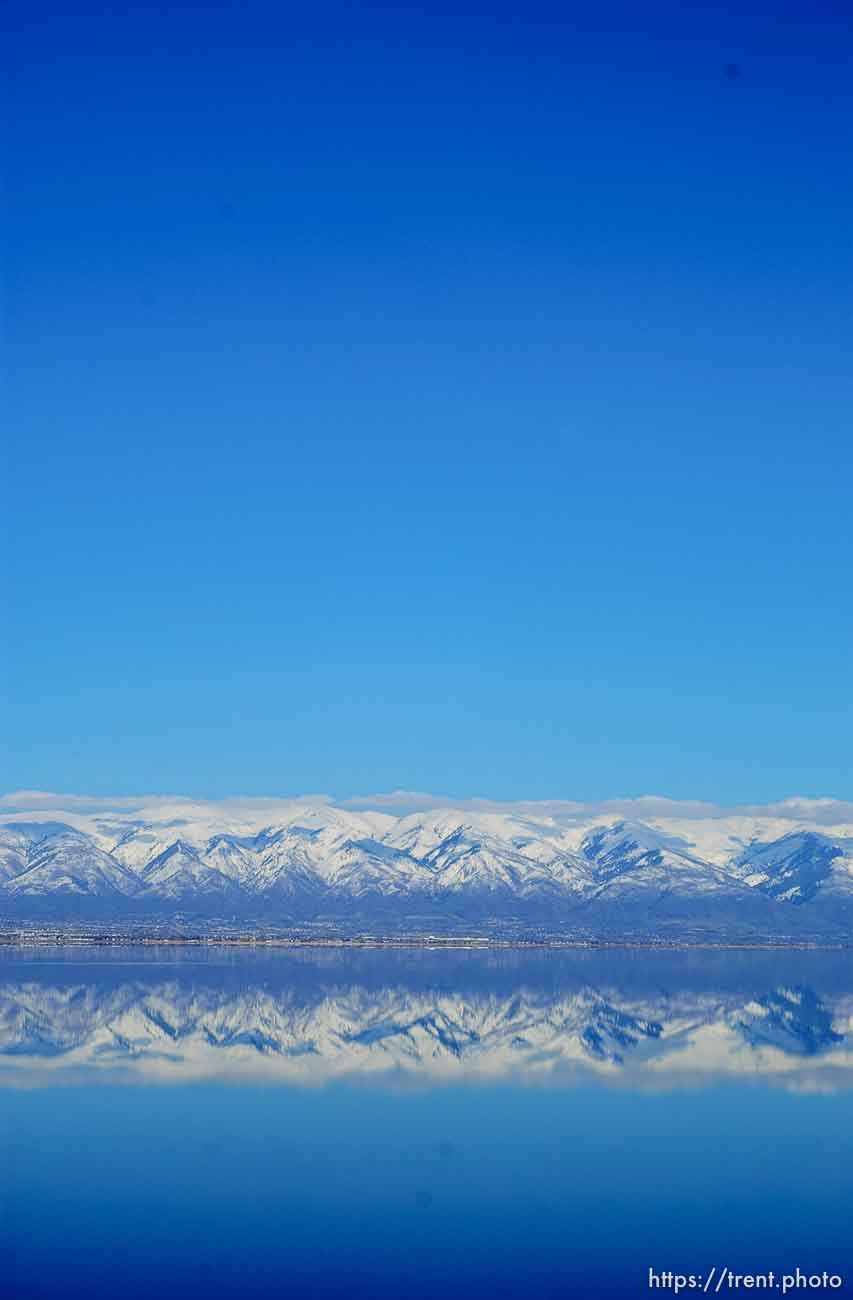 Mountains and snow reflected in Great Salt Lake. Davis County project. 04/05/2005