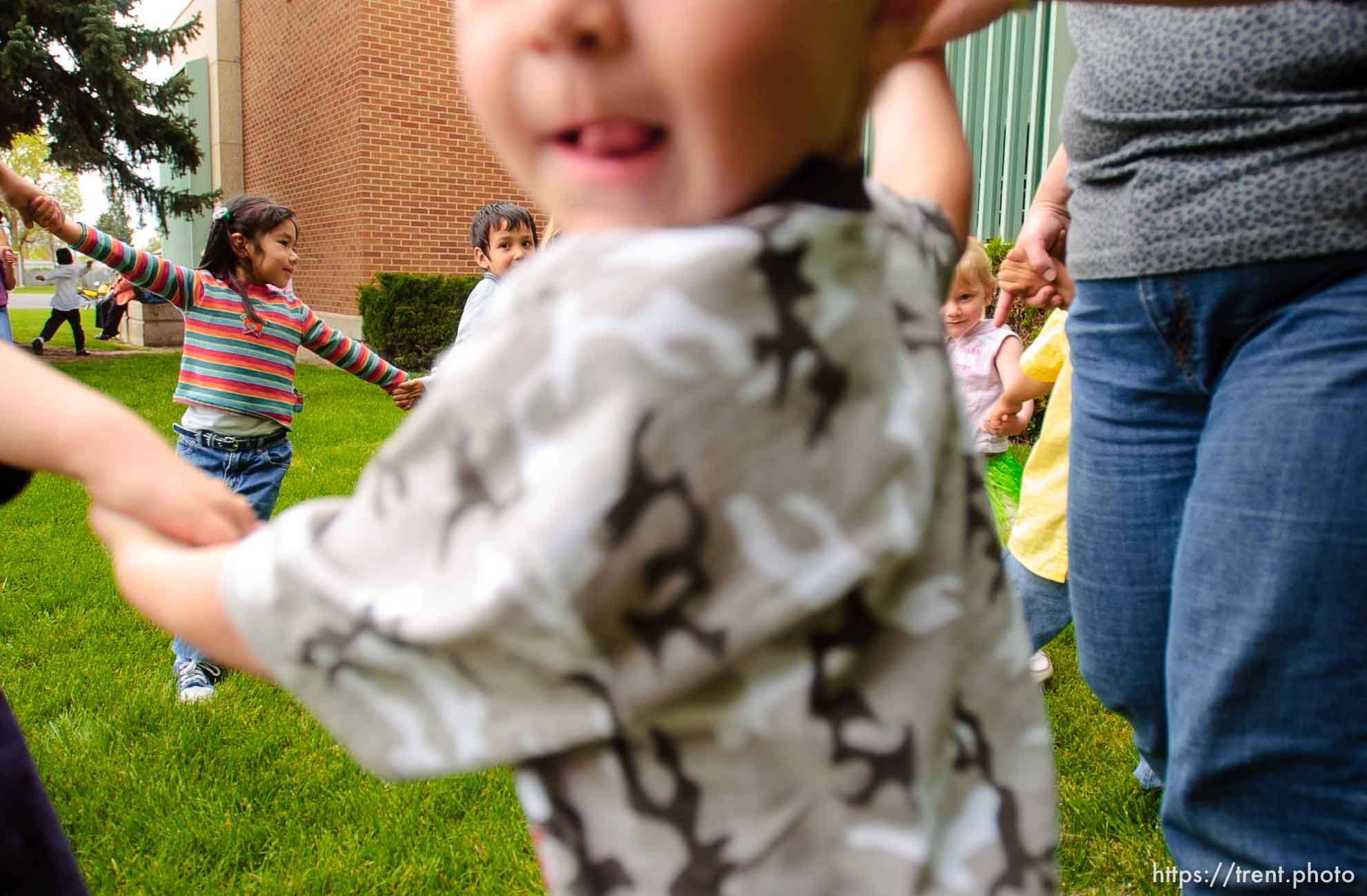 kids dancing in a circle, ring. Midvale Elementary held a Cinco de Mayo celebration Thursday afternoon, as students enjoyed the mariachi band Sol de Jalisco.
 05/05/2005